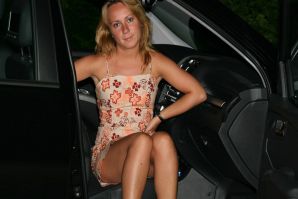 The blonde spread her legs in the car and fingering the clitoris. Thumbnail 1