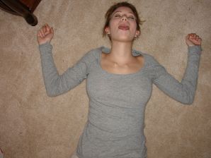 A young girl spread her legs and fingers her wet labia with her fingers. Thumbnail 7