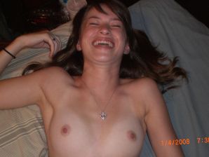 A girl in pink shorts is lying in bed. Thumbnail 1