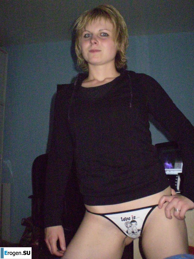 A young blonde in red lingerie stood up with cancer and spreads her pussy. Slide 1