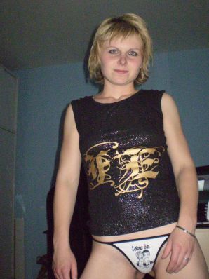 A young blonde in red lingerie stood up with cancer and spreads her pussy. Thumbnail 2