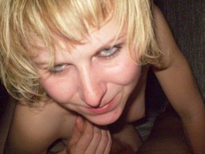 A young blonde in red lingerie stood up with cancer and spreads her pussy. Thumbnail 3