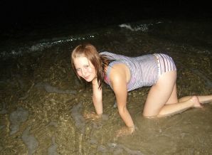 A young girl with a beautiful figure poses in shorts. Thumbnail 1