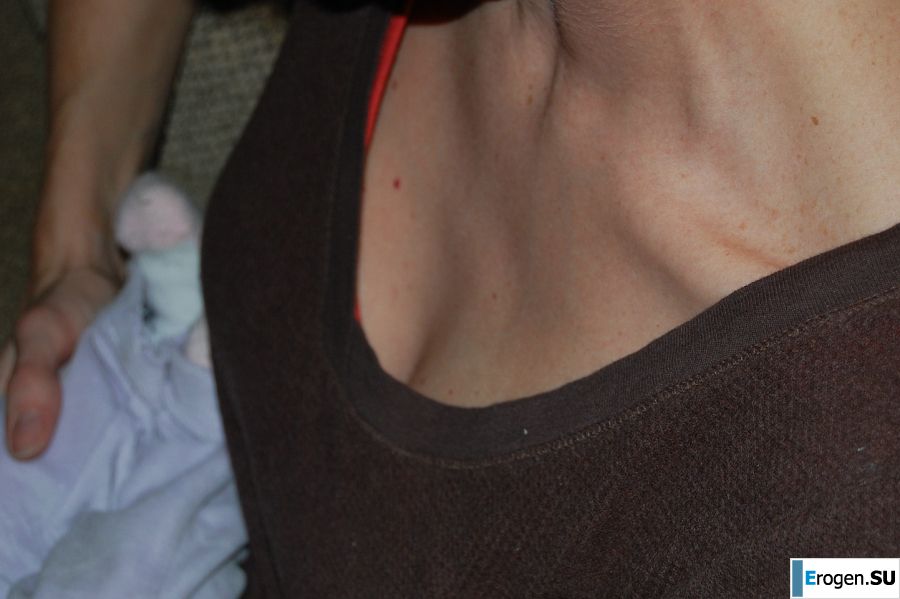A slender woman with neat breasts takes off her clothes. Slide 31