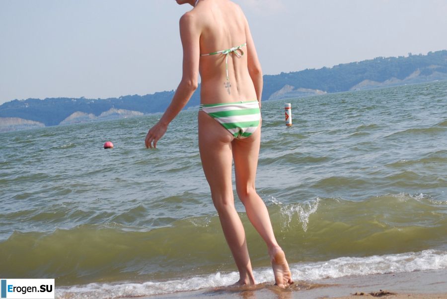 A slender woman with neat breasts takes off her clothes. Slide 33