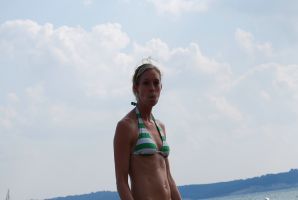 A slender woman with neat breasts takes off her clothes. Thumbnail 19