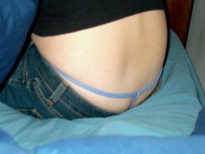 A brunette takes off her underpants and masturbates, not embarrassed by a guy. Thumbnail 8