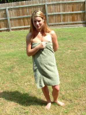 A blonde with a beautiful figure poses naked on the lawn. Part 3. Thumbnail 16