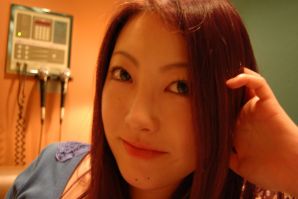A sultry Asian woman spreads her labia with her fingers and shows a vagina. Thumbnail 4