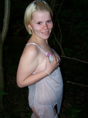 Appetizing magnificent blonde spread her legs right on the grass. Thumbnail 13