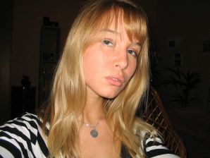 A young blonde in stockings spreads her legs on the sofa. Thumbnail 3