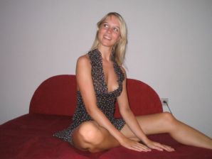A young blonde in stockings spreads her legs on the sofa. Thumbnail 31