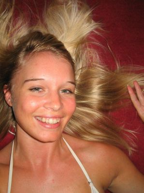 A young blonde in stockings spreads her legs on the sofa. Thumbnail 35