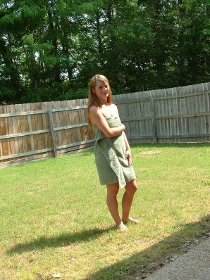 A blonde with a beautiful figure poses naked on the lawn. Part 4. Thumbnail 18