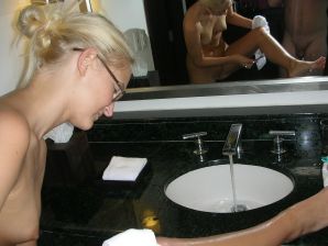 A pretty blonde is laid bare in the toilet and spreads her legs in bed. Part 4. Thumbnail 7