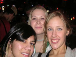 A sexy girl lights up at a party in fishnet stockings. Thumbnail 1