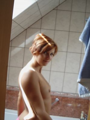 Naughty red-haired girl in pink panties fingering nipples. Thumbnail 7